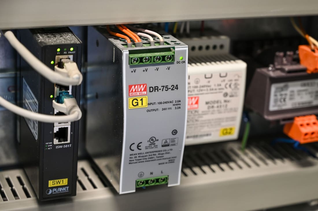 DIN-rail control gear and power supply inside a control panel