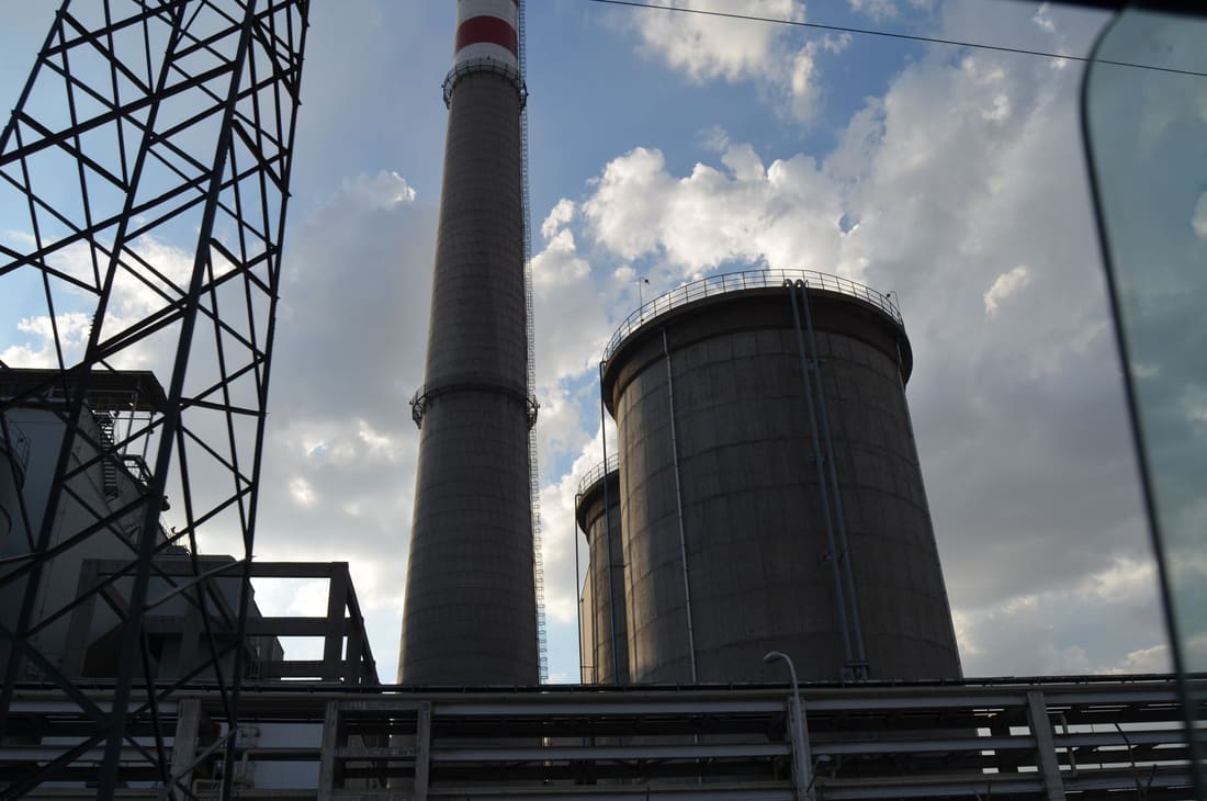 Heavy industrial plant with stacks and cooling towers